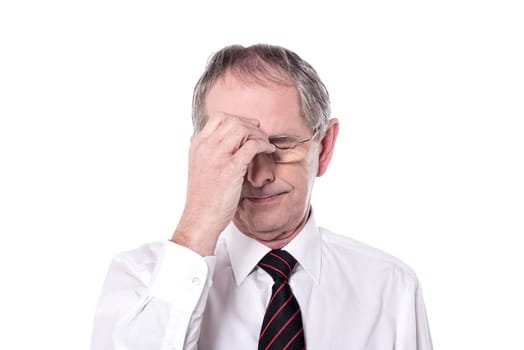 Image of depressed senior man suffering from headache