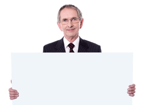 Portrait of Senior business man displaying blank ad