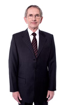 Senior executive wearing eyeglasses and posing to camera