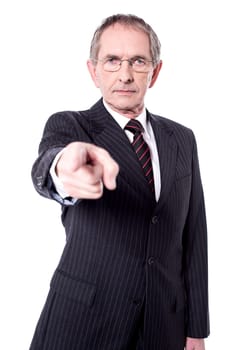 Serious senior director pointing index finger at you.