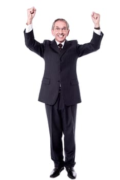 Corporate man standing with arms up against white background
