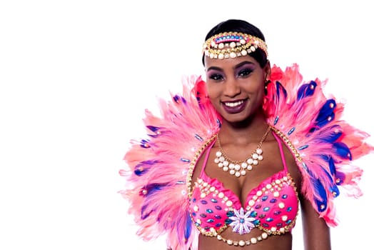 Happy female samba dancer wearing a colorful costume