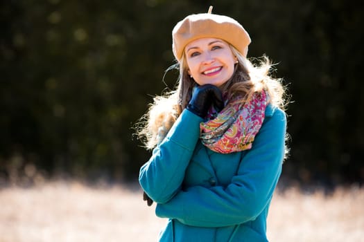 blond casual woman happy outdoors in the park
