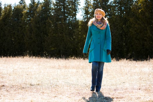 blond casual woman happy outdoors in the park