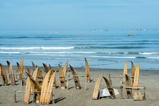 Traditional Peruvian small Reed Boats (Caballitos de Totora), straw boats still used by local fishermens in Peru