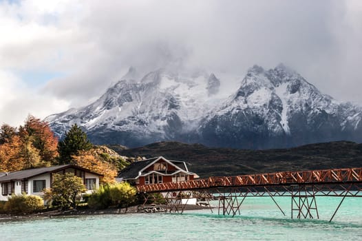 Lake Pehoe at the foot of the magnificent snow-covered cliffs of Los Cuernos. National Park Torres del Paine, Chile