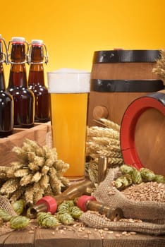old beer carrier with beer glass,wheat,barley,hops and malt