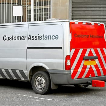 Commercial Van for Customer Assistance Parked on a Street