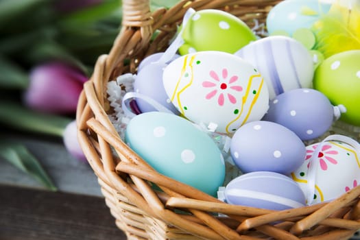 Colorful Easter eggs in basket.
