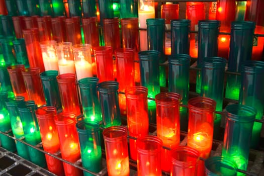 Red and green candles in the Monserrat Abby, Catalonia, Spain