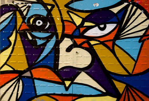 Detail of a Barcelona metal door graffiti art that imitates Gaudi painter plays