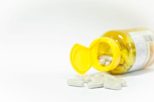Close up capsules pill on white background, stock photo