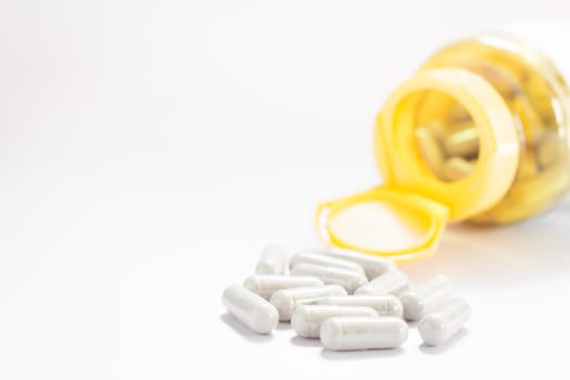 Close up capsules pill on white background, stock photo
