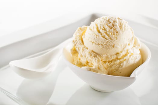 Fresh fruit sorbet ice cream in a white bowl close up.