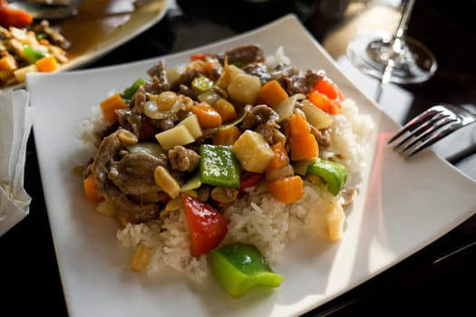 Chinese food - stir fry beef with vegetables and nuts.
