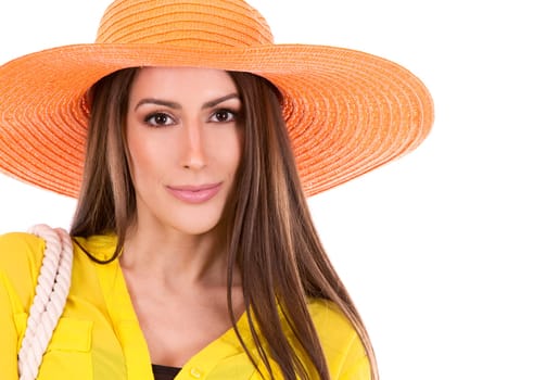 young woman wearing yellow shirt and orange hat on white background