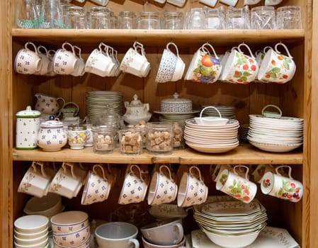 a cabinet with crockery