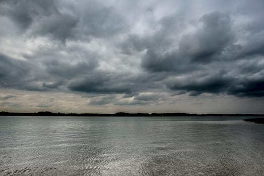 Highly reflective water on a cloudy morning