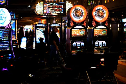 Las Vegas,United States - December 23,2015: Colorful slot machines and visitors in the foyer of Casino Excalibur on the night of December 23,2015 in Las Vegas.