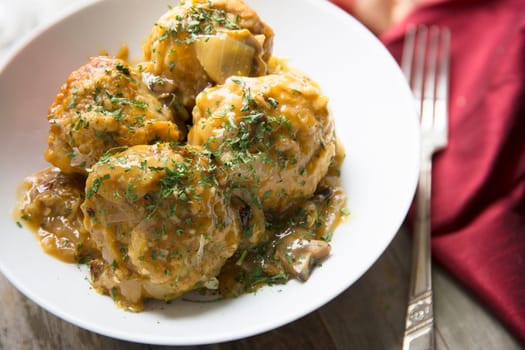 Fresh Bavarian bread dumplings with mushroom gravy sauce.