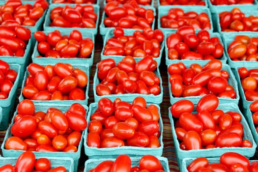 Fresh organic cherry tomatoes background, photo taken at local farmers market, in New York City.