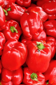 Fresh organic red bell pepper background, photo taken at local farmers market, in New York City