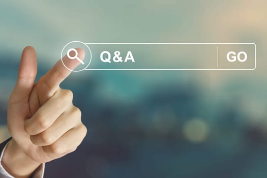 business hand clicking Q&A or Question and Answer button on search toolbar with vintage style effect