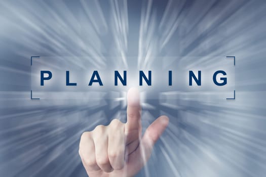 hand clicking on planning button with zoom effect background