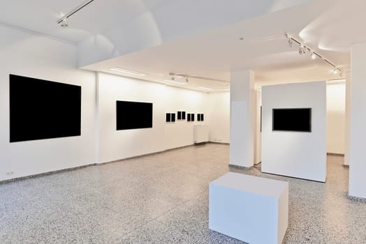exhibition gallery, wall mounted art with museum style lighting, the art has been removed and replaced. There are path for the frame