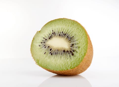 Kiwi cut in half on a white background