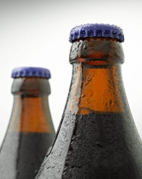 A cap of beer bottle covered with water drops