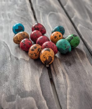 Easter concept. Quail eggs  on wooden background.Selective focus