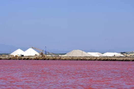 Site operating sea salt saline Aigues-Mortes in the season when a pink algae grow in the water, which gives this beautiful color.