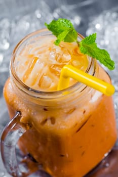 thai ice tea with milk in pitcher
