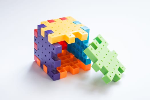 Colorful plastic jigsaw puzzle game, stock photo