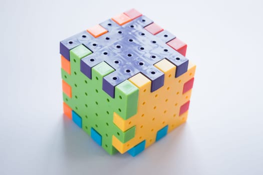 Colorful plastic jigsaw puzzle game, stock photo