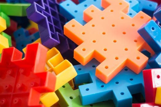 Colorful plastic jigsaw puzzle game, stock photo