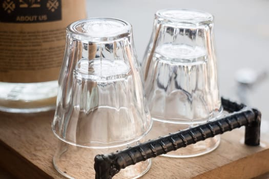 Clean glass in wooden tray, stock photo
