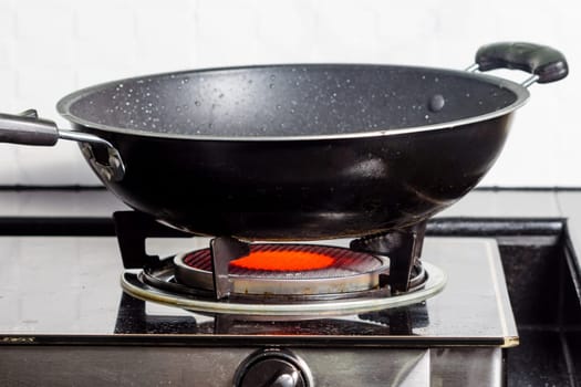 Black frying pan on gas stove