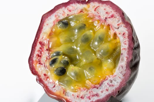Passion Fruit Cross Section Close up on white background.