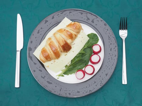 Cheese croissant on radishes