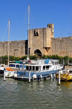 The marina of Aigues-Mortes in the background with the city walls.