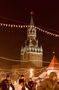 Moscow, Russia - January 05, 2016: Spasskaya Tower of the Moscow Kremlin on a background of dark sky in the Christmas night