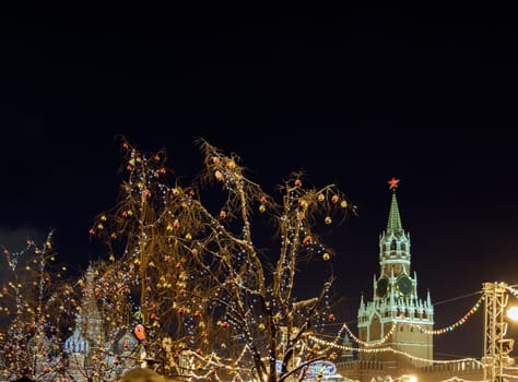 Moscow, Russia - January 05, 2016: Christmas decorations and illuminations on the branches of trees around the Red Square near the Kremlin