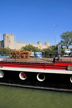 The marina of Aigues-Mortes in the background with the city walls.