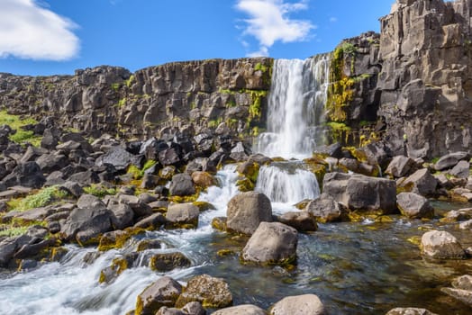 Beautiful Oxararfoss waterfall in summer, Thingvellir National Park, Iceland