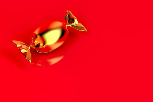 Gold wrapped candy on shiny red background