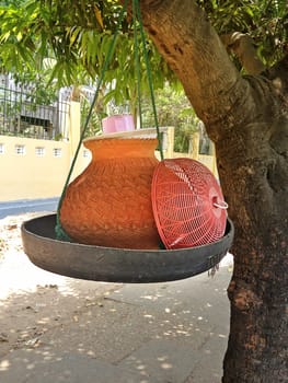 Clay containers containing drinking water for public consumption along a street in Yangon, Myanmar.