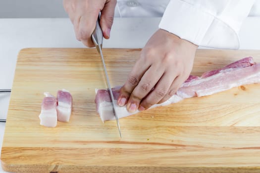 chef sliced streaky pork on cutting boards