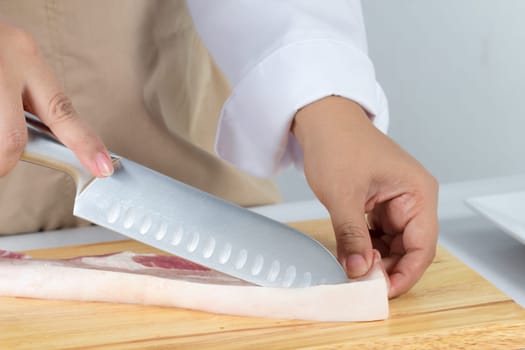 chef sliced streaky pork on cutting boards